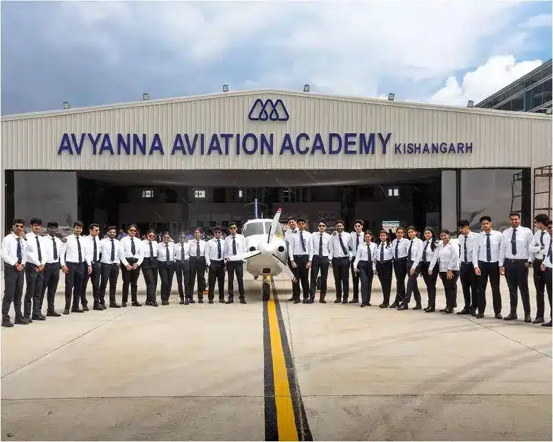 Avyanna Aviation Academy students lined up in front of the academy hangar at Kishangarh